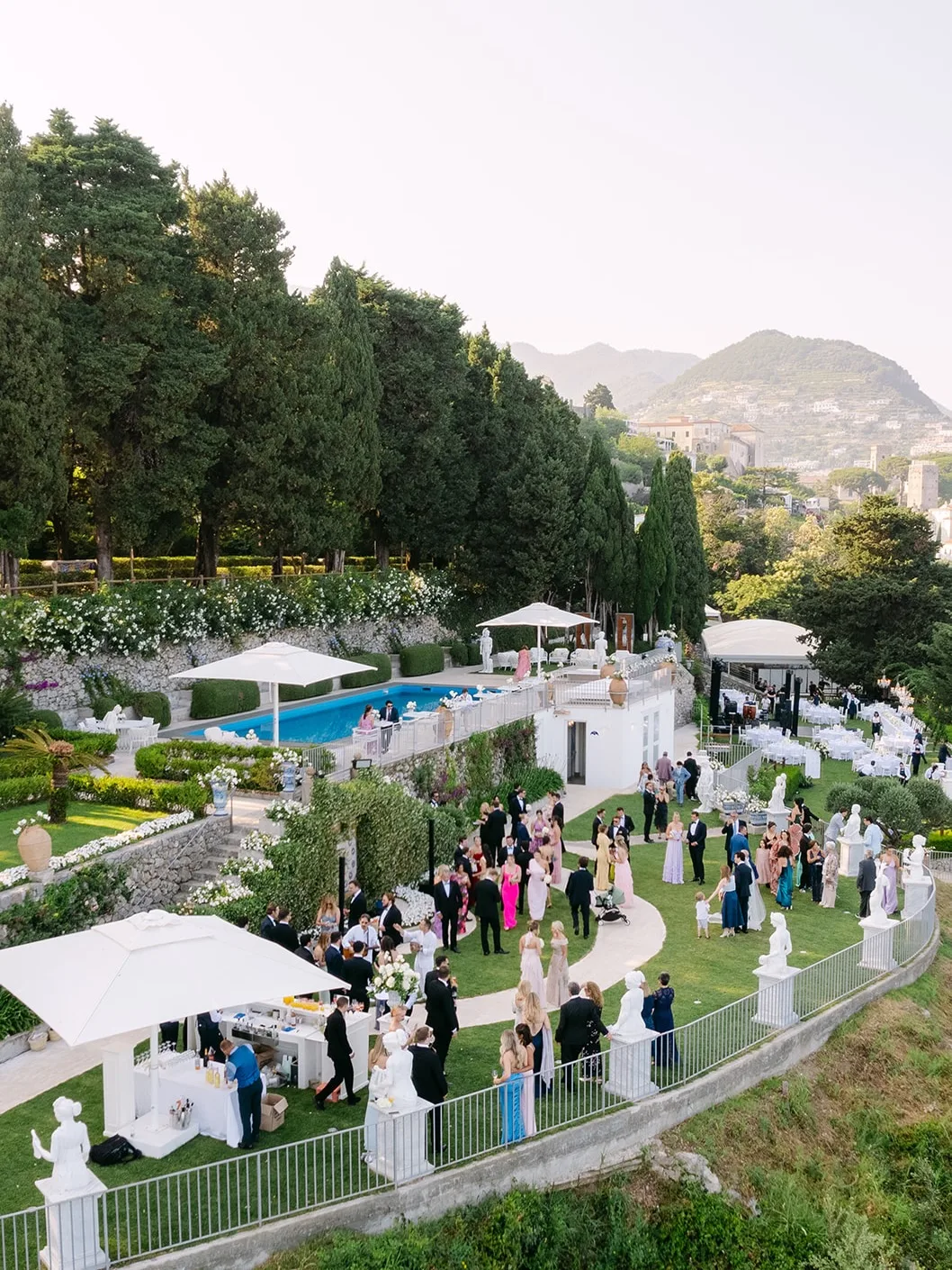 Villa garden reception filled with wedding guests
