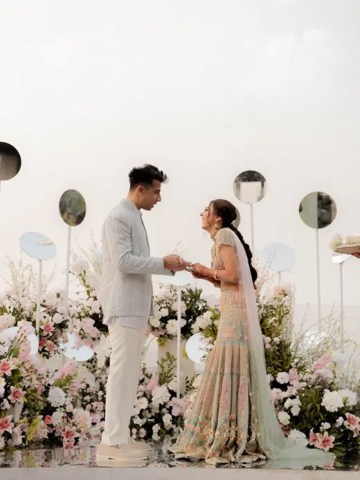 Elegant wedding ceremony with a floral backdrop