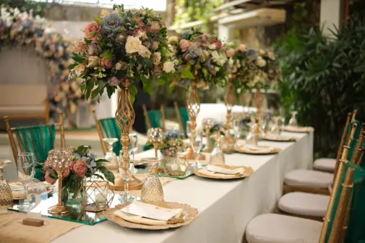 Wedding dinner table with abundant flowers