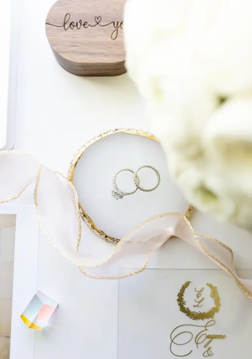 Wedding rings and stationery styled together
