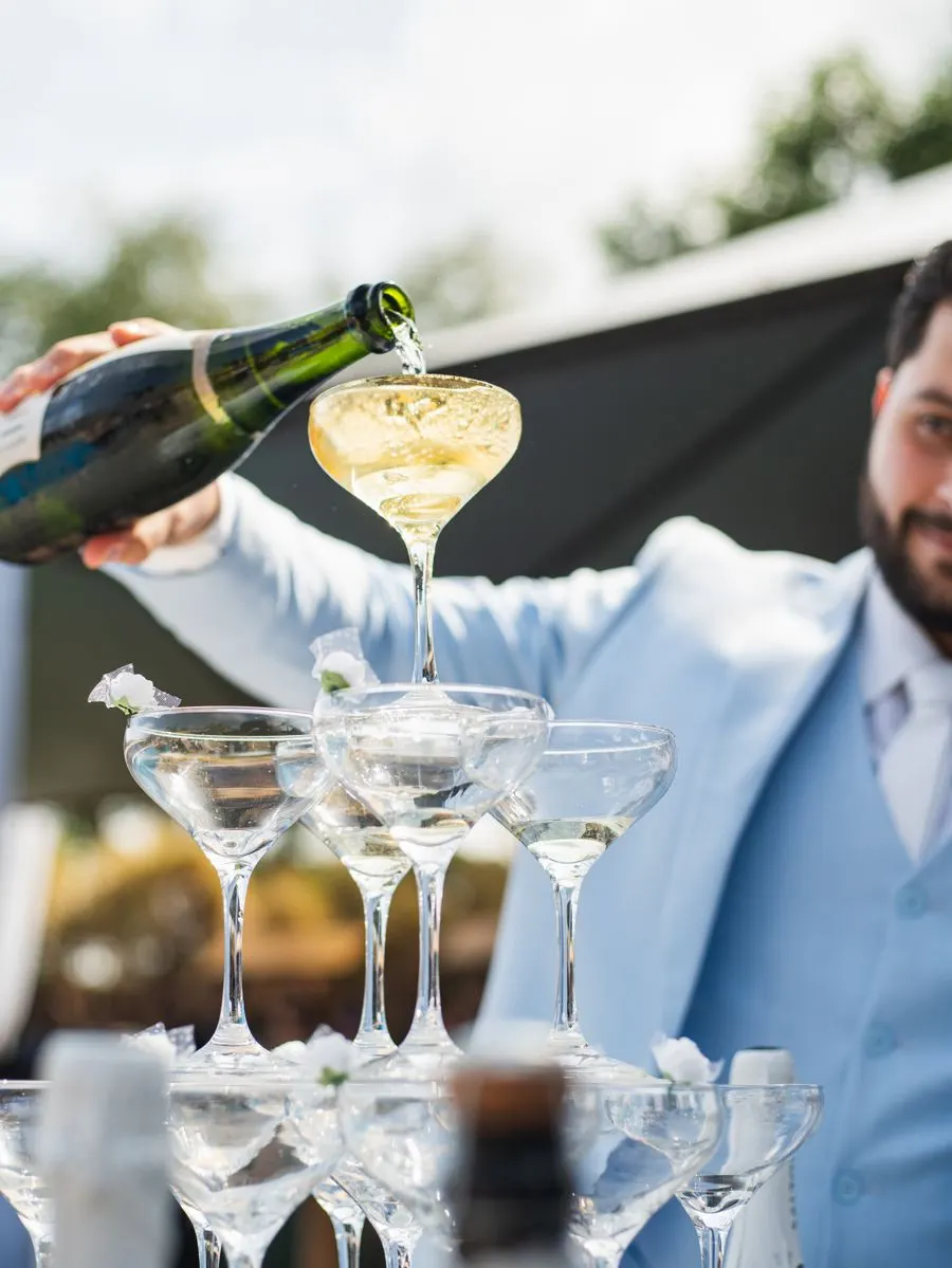 Champagne poured into a tower at a wedding