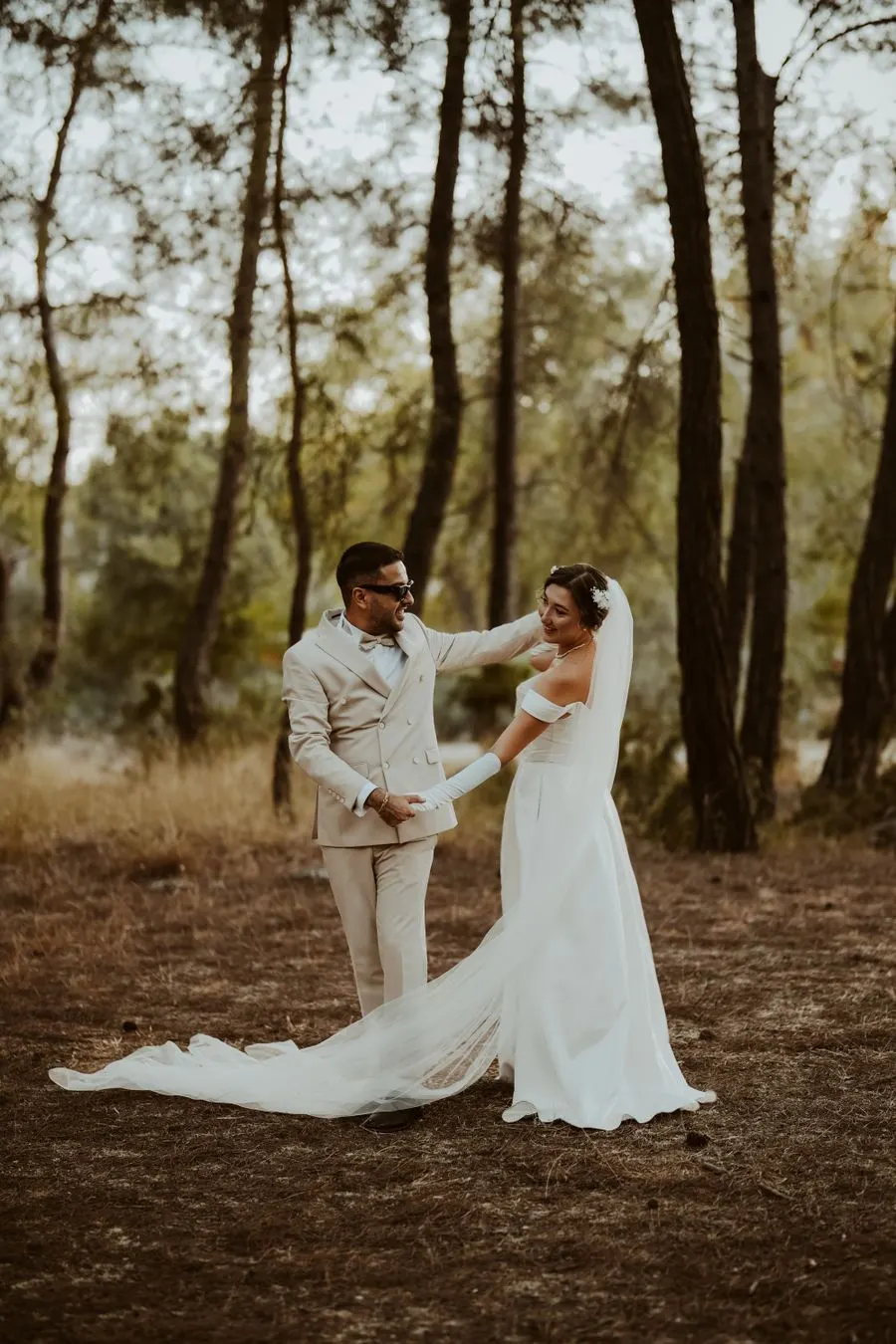 Wedding couple dancing in a wooded setting