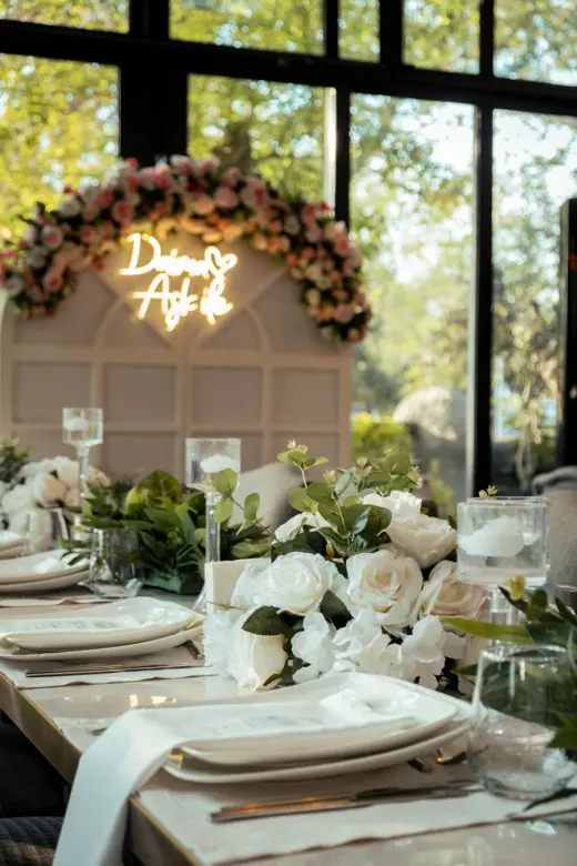 Elegant place setting with flowers and glassware