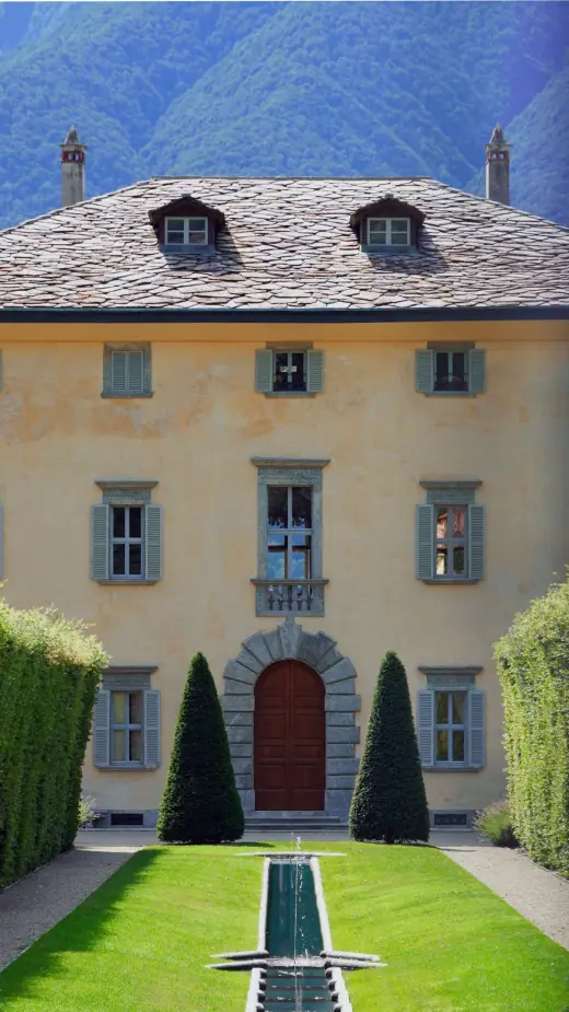 Historic Italian villa exterior framed by gardens