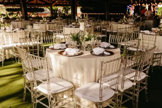 Outdoor reception table with floral arrangements