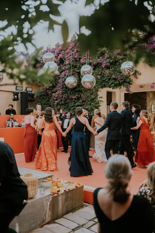 Guests celebrating at an outdoor wedding reception