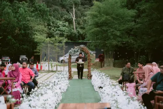 Garden wedding ceremony with guests