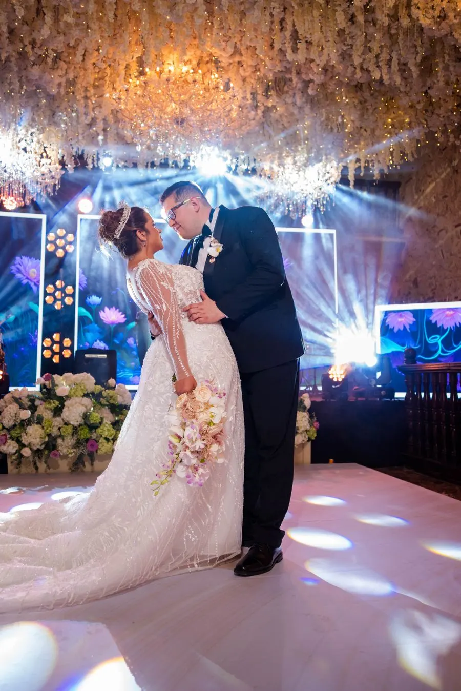Wedding couple dancing at an evening reception