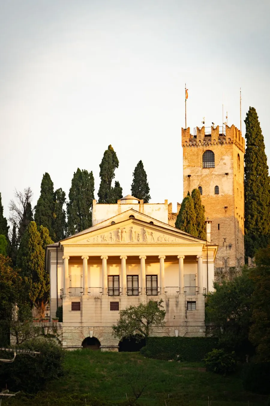 Italian villa with tower and cypress trees