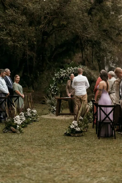 Garden ceremony setup beneath trees