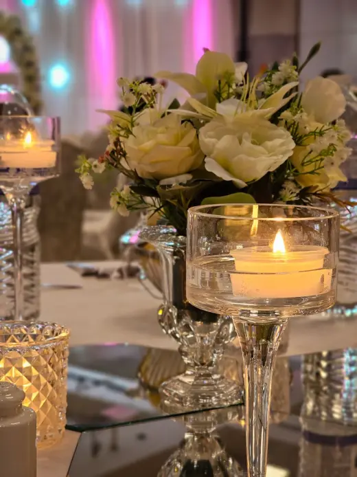 Wedding table styled with candles and flowers