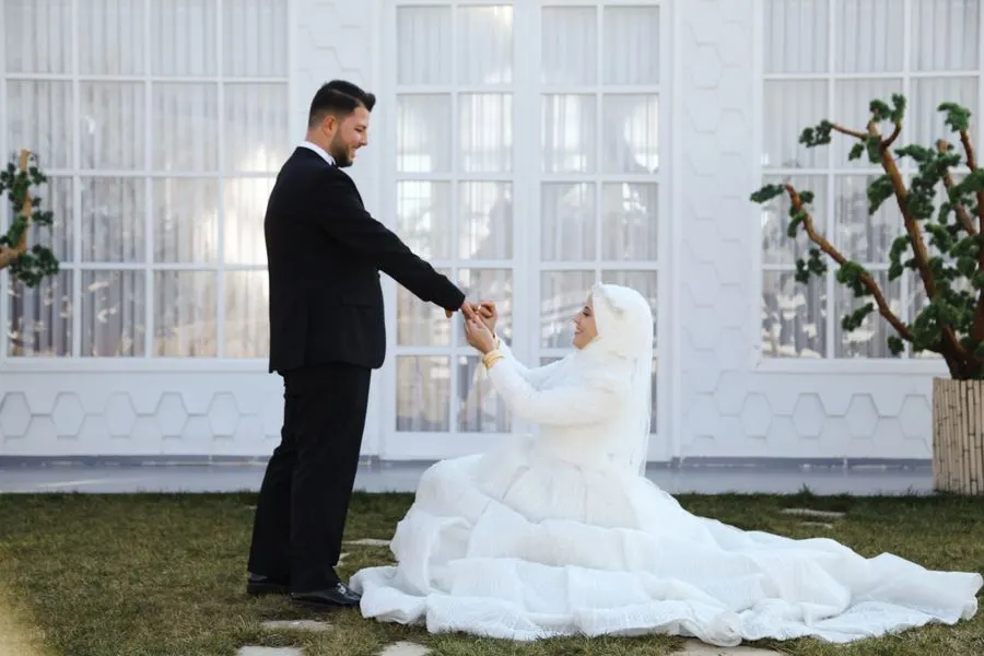 Couple at an outdoor wedding by a villa